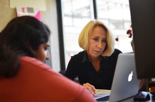 one of our reference librarians assists a student with a information request